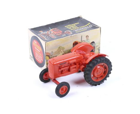 A Pippin Toys Nuffield model tractor. In plastic with rubber tyres and original box.