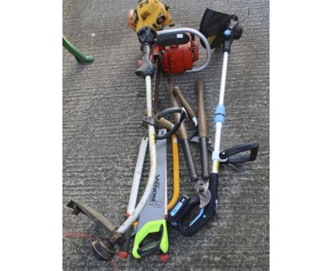 A collection of assorted garden tools. Including a JCB petrol garden strimmer, a petrol chainsaw plus some hand tools.
