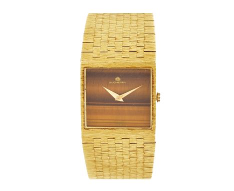 Man's Vintage Circa 1960s-1970s Bucherer 18 Karat Yellow Gold Bracelet Watch with Tiger Eye Dial, Manual Movement. Stamped 18