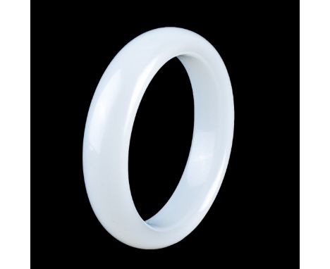 A Chinese White Jade Bangle Bracelet. Measures 3-1/4" dia, measures 2-5/8" dia (interior). Condition: Good condition Estimate