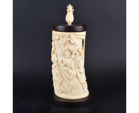 Antique African Ivory Tusk Relief Carving with Cover. Deep relief with figures, mounted on wood and has a pineapple finial to