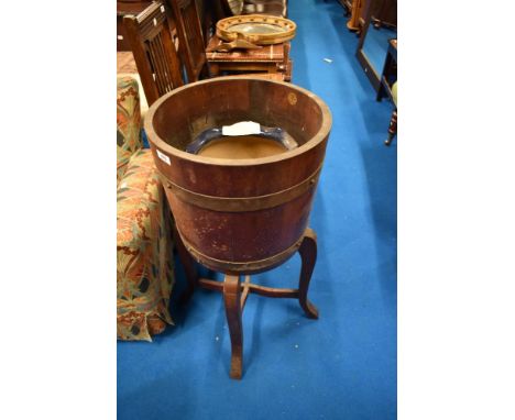 A vintage barrel style planter on stand and a Lovatts jardiniere