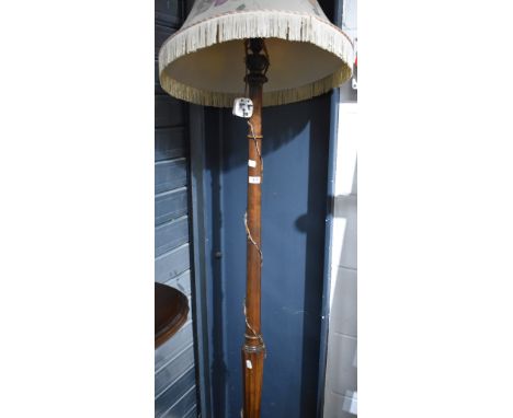 A traditional stained frame standard lamp