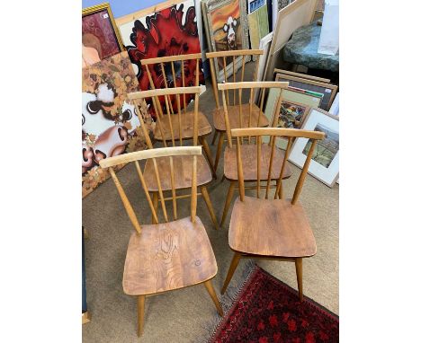 Mid Century set of six Ercol elm seated and stick back dining chairs together with an accompanying circular table