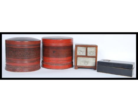 A collection of Chinese items to include a pair of led lacquered rice boxes of cylindrical form, a black lacquer glove or jew