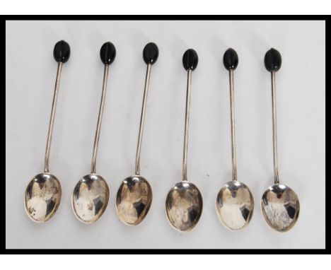 A set of six early 20th Century hallmarked silver coffee bean tea spoons by&nbsp;Henry Williamson Ltd having bakelite bean fi