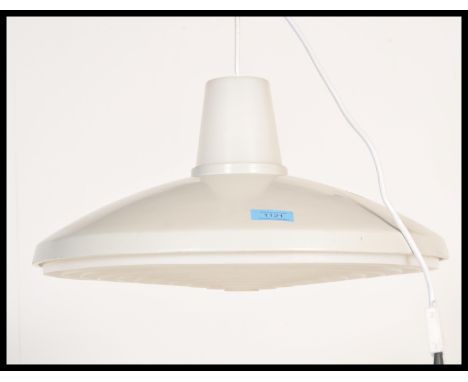 A vintage retro 20th Century ceiling light lamp fixture of UFO shape finished in white withy a plastic honeycomb diffuser. Me
