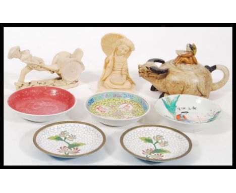 A collection of Chinese and Oriental wares to include a porcelain Yixing teapot in the form of an Ox and farmer, figurines, p