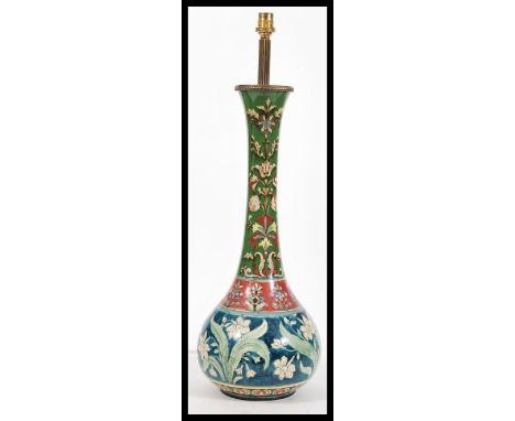 A large early 20th Century Edwardian Royal Bonn table lamp in the Old Dutch pattering having hand painted stylised floral dec