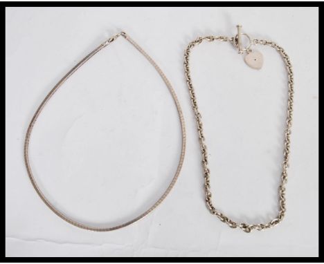 A silver hallmarked ladies chain necklace with a decorative toggle clasp with heart pendant (chain measures 15 inches) along 