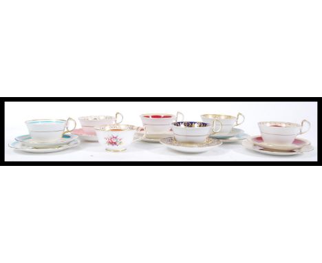 A collection of 20th Century Aynsley Fine English Bone China cups and saucers to include four cup saucer side plate trios, tw