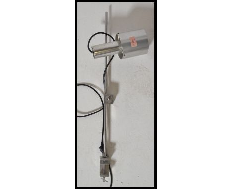 A vintage retro 20th Century chrome and brushed steel anglepoise industrial desk lamp by Magia raised on clamp base with tubu