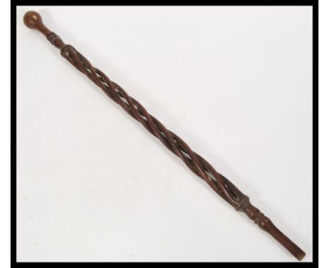 A 19th Century Victorian folk art walking stick cane having a carved twist open column with knob handle atop.