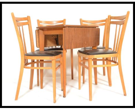 A set of four vintage retro 20th Century Ercol style Czechoslovakian dining chairs along with a formica dining table.