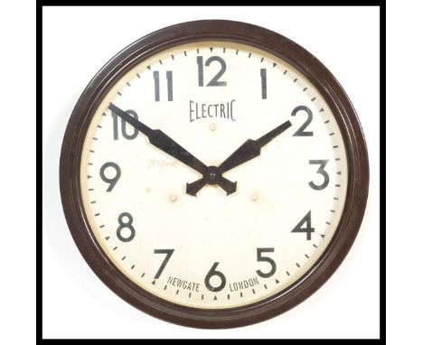 A vintage retro 20th century industrial&nbsp; factory / school wall clock of circular form with faceted&nbsp; hands and stamp