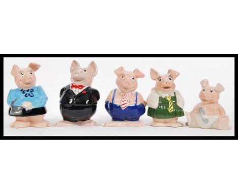 A group of five vintage advertising Natwest ' piggies ' ceramic money boxes in the form of pigs to include Woody, Annabel, Ma