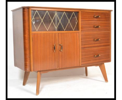 A vintage retro 20th Century Art Deco walnut veneered sideboard cabinet raised on splayed legs with brass and bakelite handle