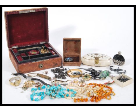 A good collection of vintage jewellery to include a Miracle rhinestone brooch, necklaces, perfume bottle, faux amber necklace