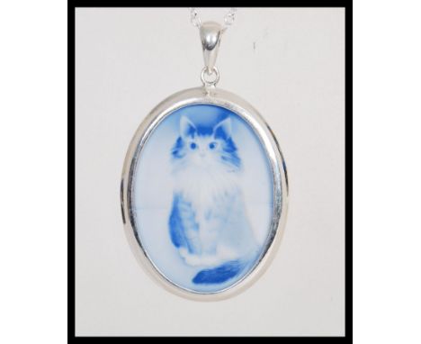 A stamped 925 silver necklace having a large blue cameo pendant having an engraved cat. Weight 12.3g. Chain measures 20 inche