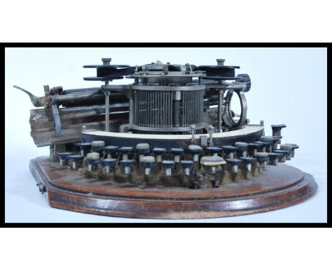 A vintage early 20th Century Edwardian American USA Hammond Typewriter No2 of Skeleton type with piano keys. Silver plated pl