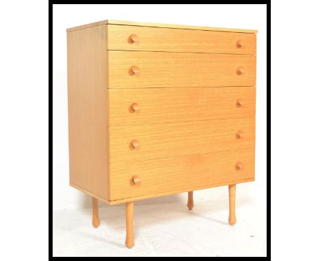 A vintage / retro 20th Century teak wood chest of five graduating drawers raised on tapering supports with applied makers lab