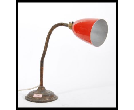 A vintage retro 20th Century industrial gooseneck table desk lamp raised on stepped circular base with adjustable goose neck 