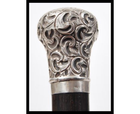 A 19th Century Victorian silver hallmarked topped gentleman's evening opera walking stick promenade cane having a tapering eb