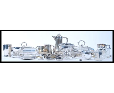 A large collection of silver plate items to include a coffee pot with matching creamer and sugar bowl, serving dishes, a spil