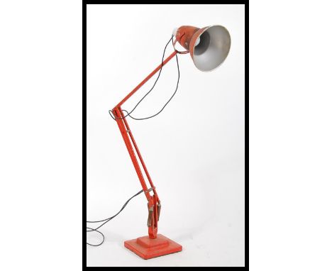 A 1940's Industrial pre-war Herbert Terry anglepoise lamp, raised on a cast metal two step base with pendant shade, finished 