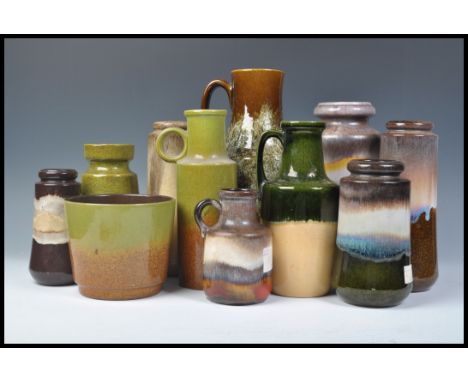 A collection of vintage retro 20th Century West German fat lava style pottery all in a green and brown colourway to include s