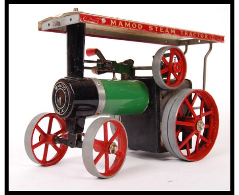 A vintage Mamod made live steam stationary traction engine TE1A. Green and black, with cream and red canopy.&nbsp;