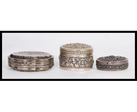 A group of silver items to include t90 silver stamped trinket pot of cylindrical form having embossed relief scrollwork, a si