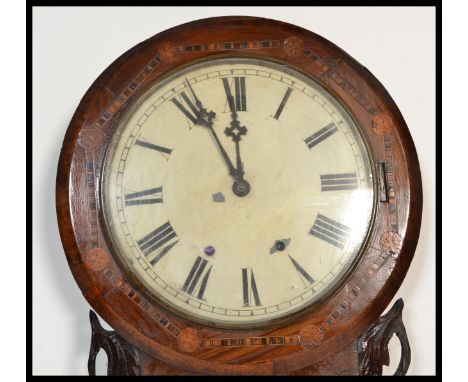 A late 19th Century Victorian marquetry inlay mahogany wall clock having Maltese cross type decoration. The white enamel face