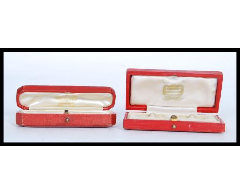 Two vintage designer Cartier jewellery boxes, one for cufflinks and the other for stick pin, each having a leatherette exteri