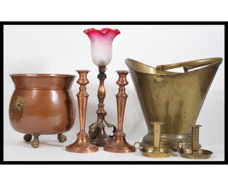 A collection of 19th Century copper and brass to include a copper coal scuttle with lion mask decoration, a brass example of 