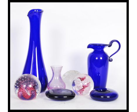A collection of vintage 20th Century studio art glass paperweights to include swirl, flash ruby and control bubble etc. Measu