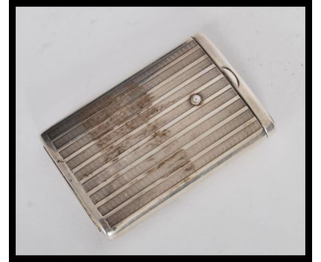 A vintage 20th century silver vesta case with engine turned decoration to the exterior and a sliding match compartment. Bears