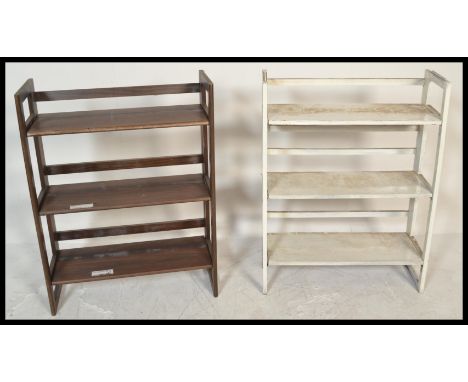 A pair of retro / vintage 20th Century folding / stacking bookcases, each with three fitted shelves. Measures 94 cm high x 70