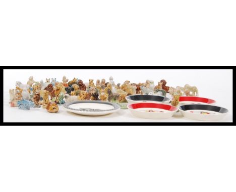 A good collection of Wade Whimsies figurines and ceramics to include a set of four playing card suits, dogs, birds, butterfli