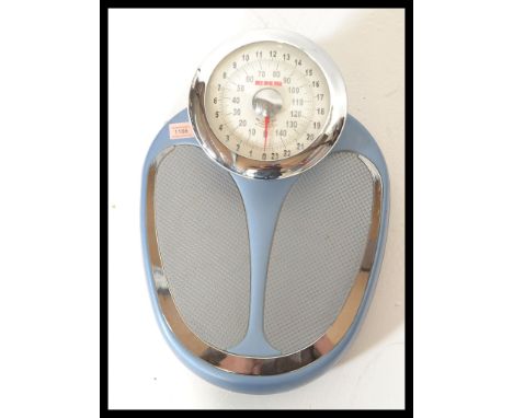 A set of vintage 20th Century doctors style weighing scales by EKS, finished in a blue enamel with foot plates both sides of 