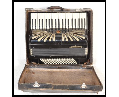 A vintage early 20th Century cased German made Regal Standard accordion