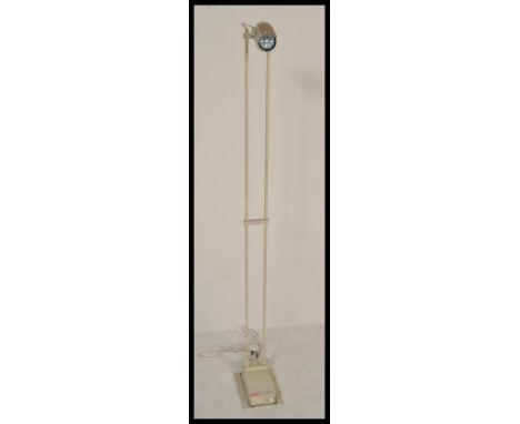 A vintage retro 20th Century floor standing spot lamp raised on a circular base with adjustable lamp top. Measures 136 cm hig