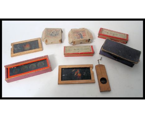 A collection late 19th and early 20th Century magic lantern slides to include various nursery rhyme and comic sets, boxed Jun