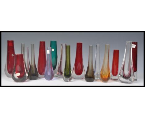 A large group of mostly Whitefriars vintage 20th Century studio art glass teardrop vases to include ruby red. sea green, smok