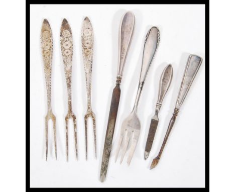 A selection of silver items to include a manicure set with silver hallmarked handles, a stamped 800 silver fork and three sta