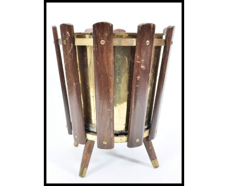 A 1960's retro vintage sputnik atomic teak wood and brass litter bin consisting of panelled teak wood section riveted to bras