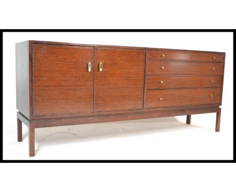 A vintage 20th century sideboard having graduation bank of draws to the left and double doors on the right finish in mahogany