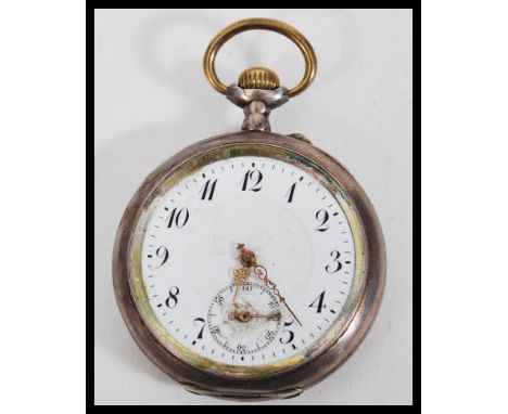 A 20th Century continental silver open face pocket watch having a white enamelled face with arabic numerals to the chapter ri