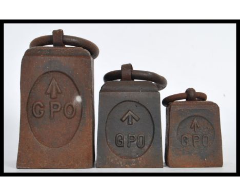 A graduating set of GPO military weights having GPO and military crows foot stamps present. The weights of square form having
