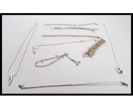 A collection of vintage silver jewellery to include a hallmarked heart lock bracelet, three stamped 925 spacer bracelets and 